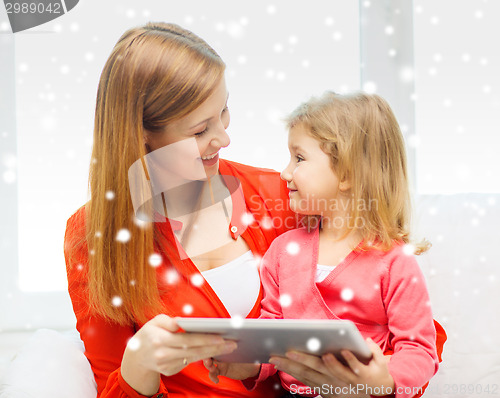 Image of happy mother and daughter with tablet pc computer