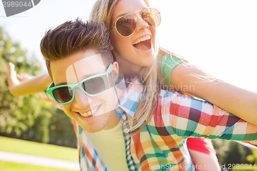 Image of smiling couple having fun in park