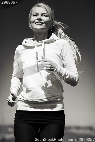 Image of woman jogging outdoors