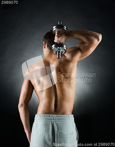 Image of young man with dumbbell