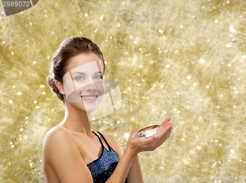 Image of smiling woman in evening dress with diamond