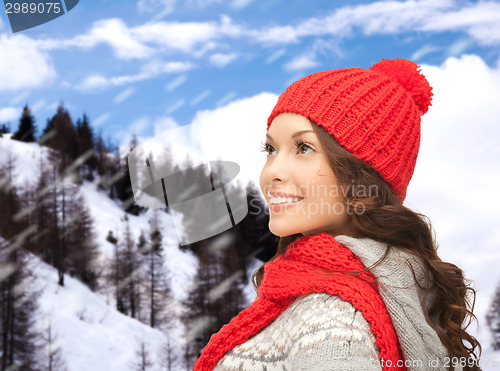 Image of smiling young woman in winter clothes