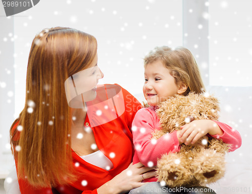 Image of mother and daughter with teddy bear toy