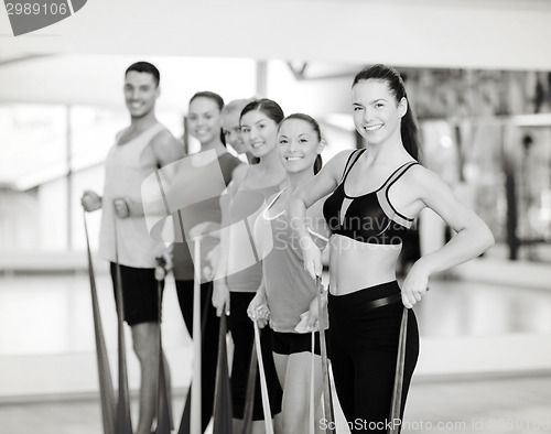 Image of group of people working out with rubber bands