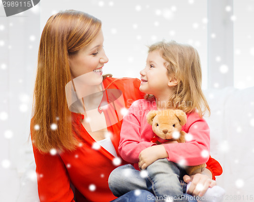 Image of mother and daughter with teddy bear toy