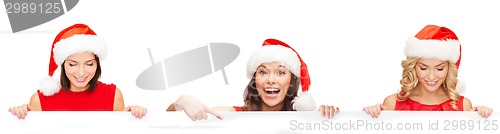 Image of women in santa helper hat with blank white board