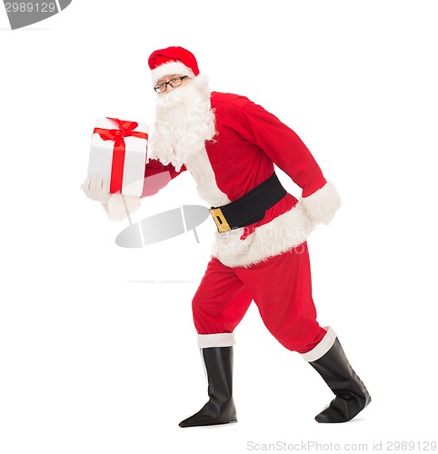 Image of man in costume of santa claus with gift box