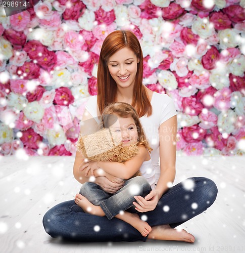 Image of happy mother with little girl and teddy bear