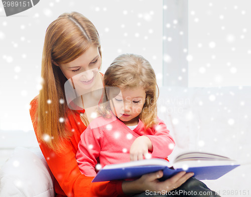 Image of mother and daughter with book