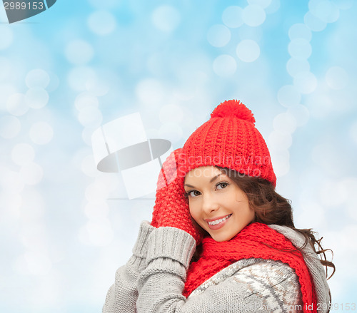 Image of smiling young woman in winter clothes