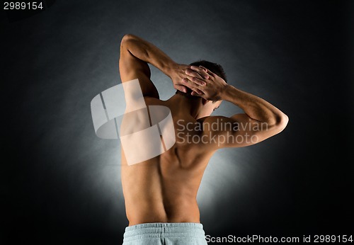 Image of young male bodybuilder from back