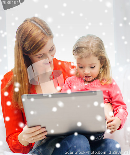 Image of happy mother and daughter with laptop computer