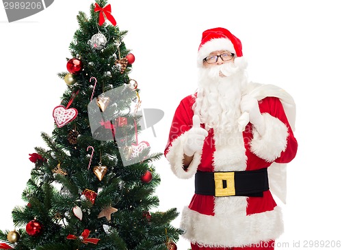 Image of santa claus with bag and christmas tree