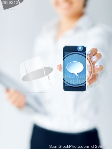 Image of close up of businesswoman showing smartphone