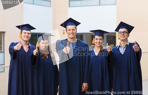 Image of group of smiling students in mortarboards