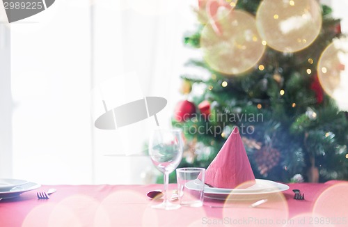 Image of room with christmas tree and decorated table