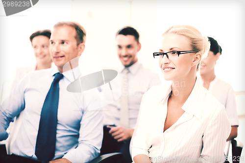 Image of businessmen and businesswomen on conference