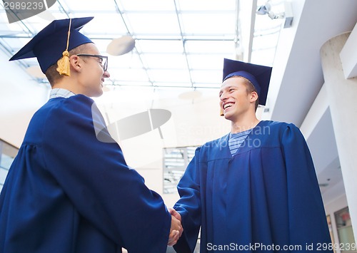 Image of smiling students in mortarboards