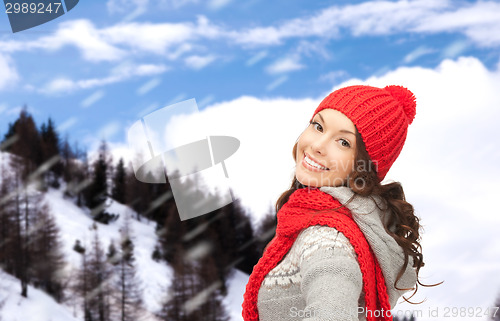 Image of smiling young woman in winter clothes