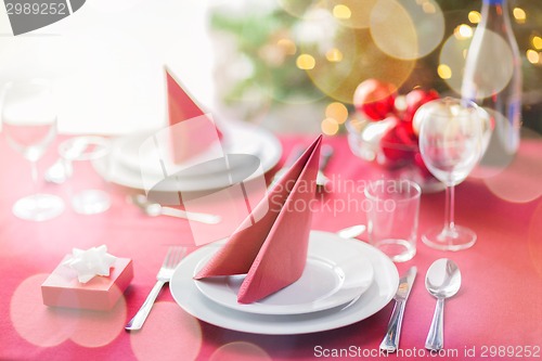 Image of room with christmas tree and decorated table