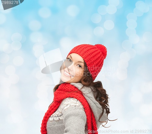 Image of smiling young woman in winter clothes