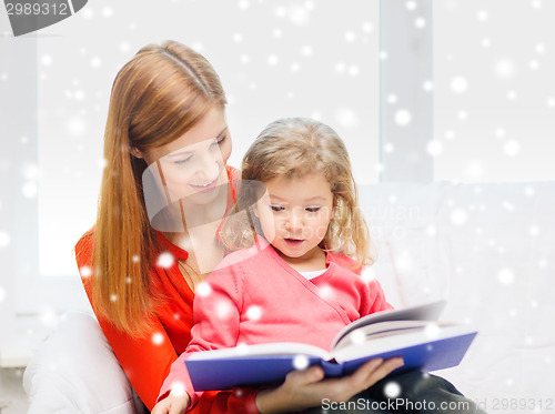 Image of mother and daughter with book