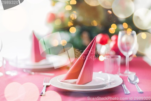 Image of room with christmas tree and decorated table