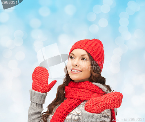 Image of smiling young woman in winter clothes