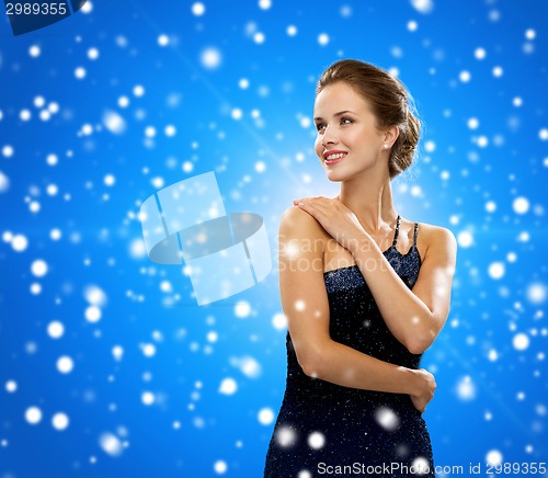 Image of smiling woman in evening dress