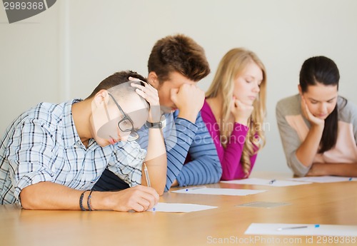 Image of group of students with papers