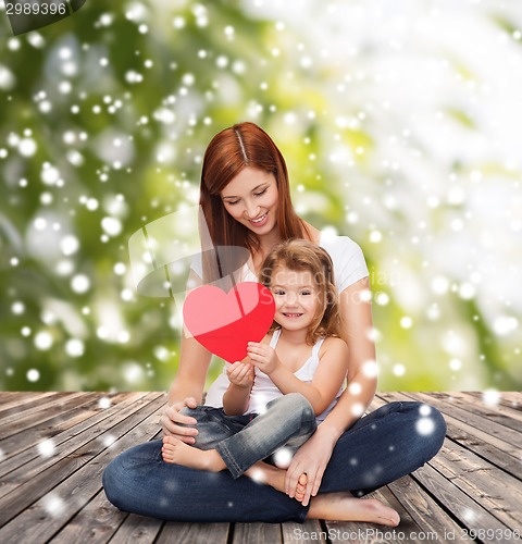 Image of happy mother with adorable little girl and heart