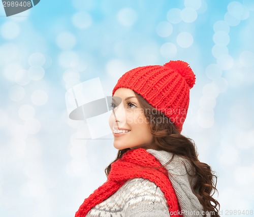 Image of smiling young woman in winter clothes