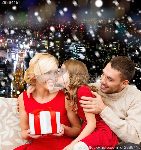 Image of happy family with gift box