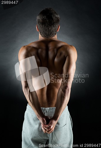 Image of young male bodybuilder from back