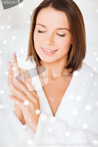 Image of beautiful woman in bathrobe