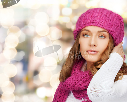 Image of smiling young woman in winter clothes