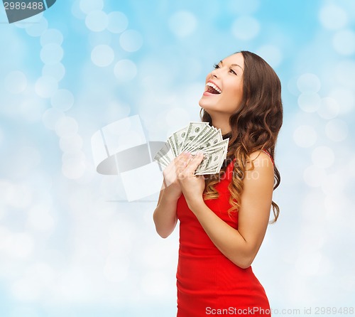 Image of woman in red dress with us dollar money