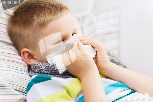 Image of ill boy with flu at home