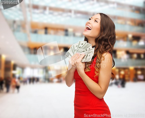 Image of woman in red dress with us dollar money