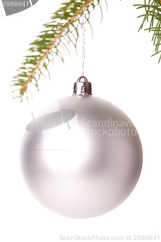 Image of Christmas ball hanging from a branch of a fir tree