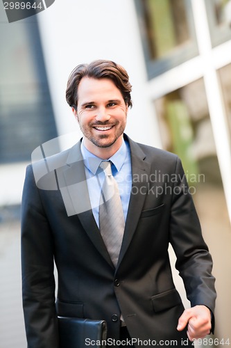 Image of Businessman standing waiting for someone