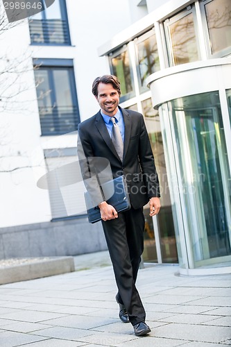 Image of Businessman standing waiting for someone