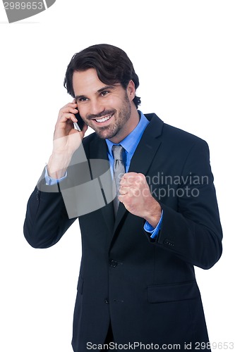 Image of Stylish businessman talking on his mobile phone