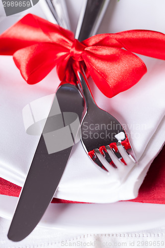 Image of Romantic red Christmas table setting