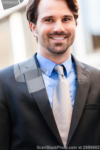 Image of Businessman standing waiting for someone