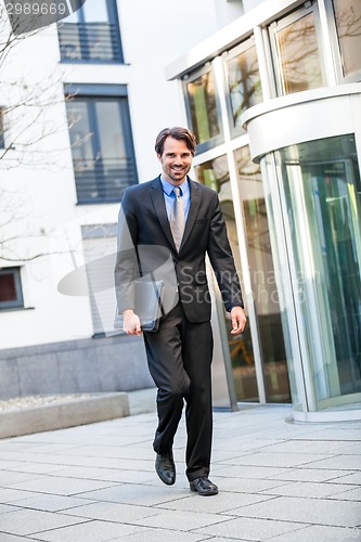 Image of Businessman standing waiting for someone