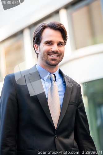 Image of Businessman standing waiting for someone
