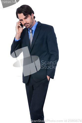 Image of Stylish businessman talking on his mobile phone