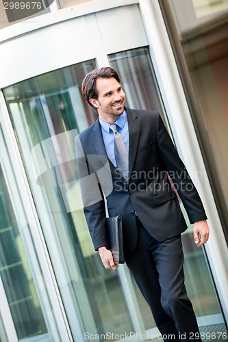 Image of Businessman standing waiting for someone