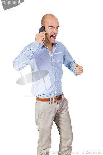 Image of Handsome man reading a message on his mobile